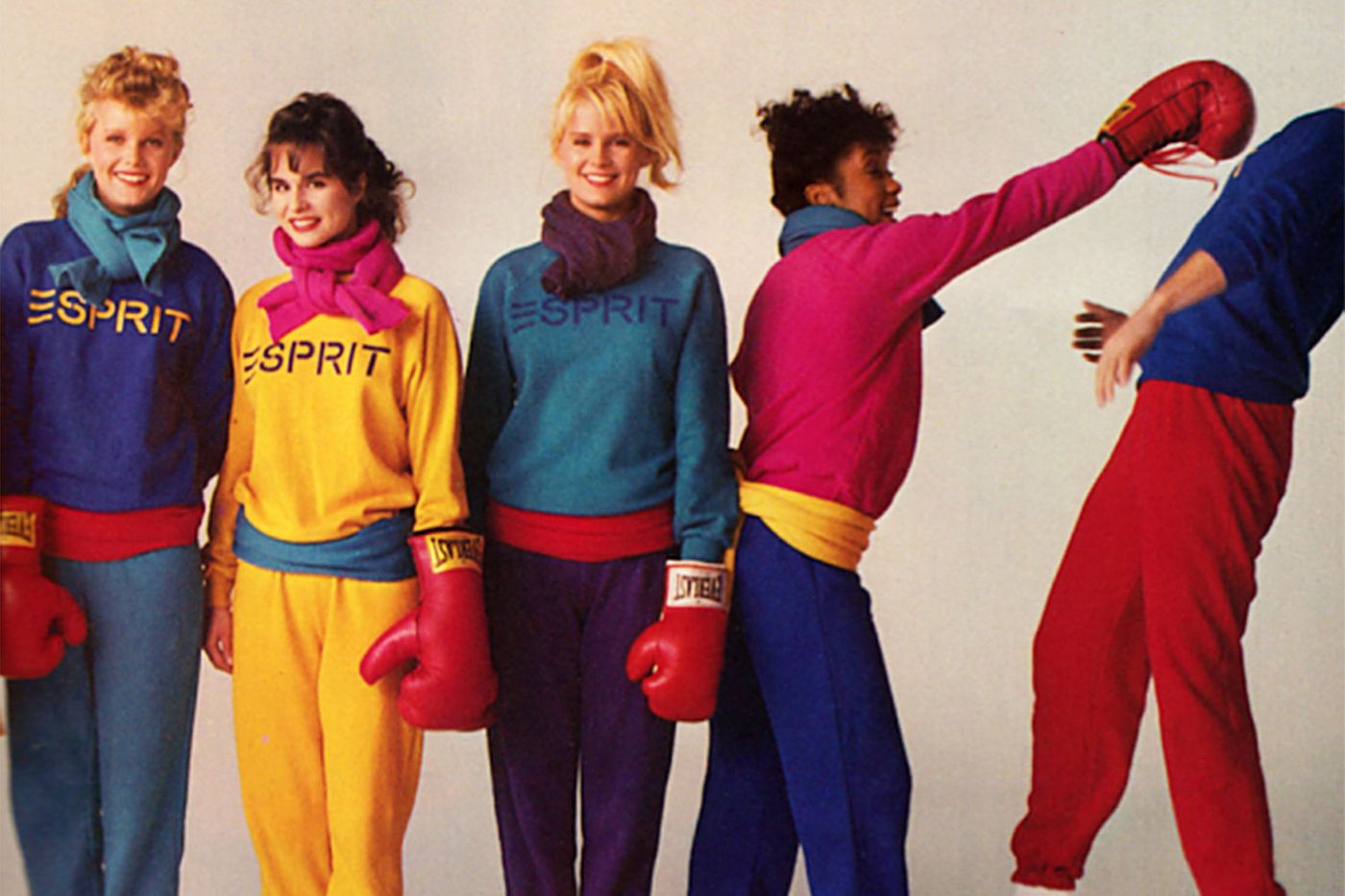 90's ad for Esprit with teenagers with solid colored sweatshirts with ESPRIT written on them